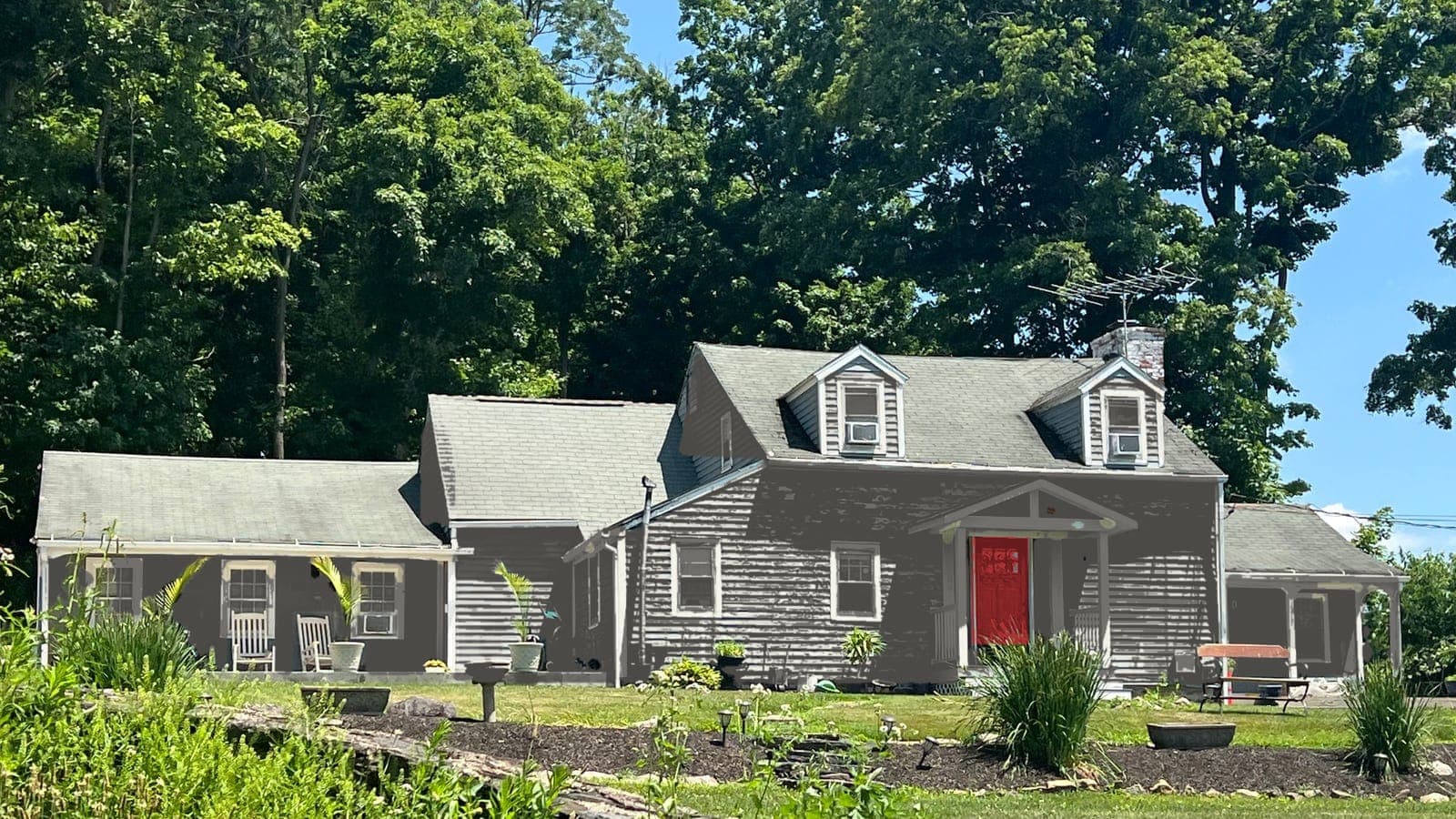 Cape Cod with lap siding and two dormers, repainted: siding Kendall Charcoal HC-166, trim White Dove OC-17, front door Caliente AF-290