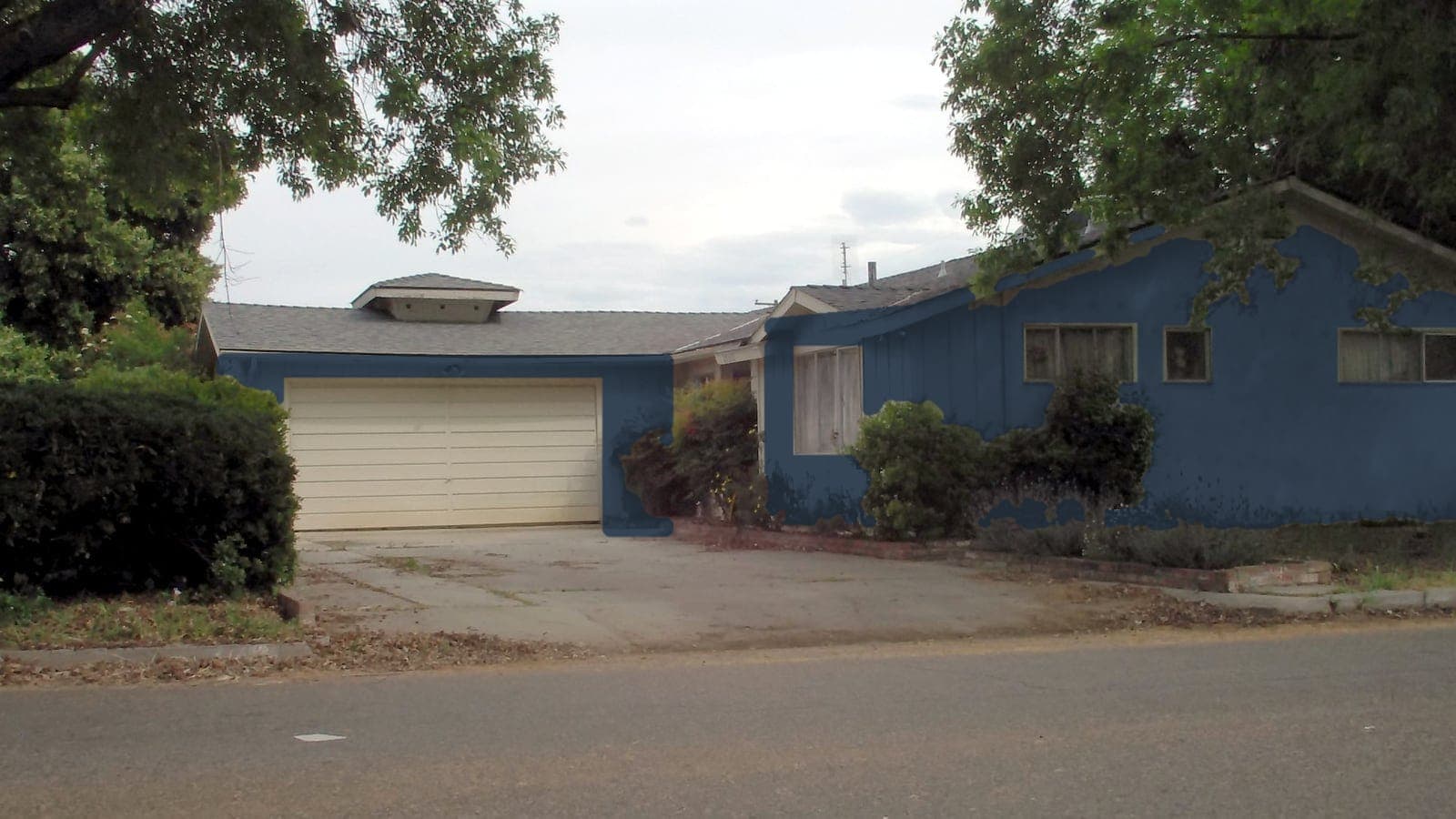 1950s California ranch, board-and-batten and stucco, repainted: siding Naval SW 6244