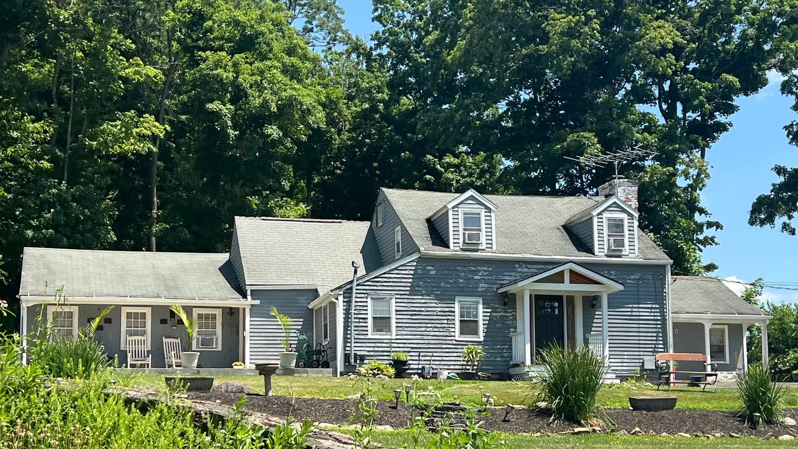 Sample house before: Cape Cod with lap siding and two dormers