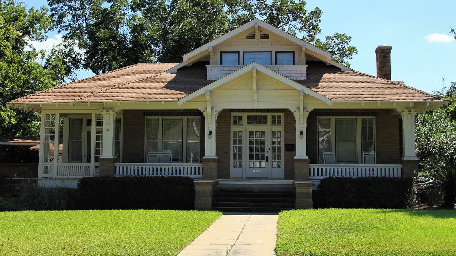 Craftsman bungalow with a brick porch and shingle roof, original photo